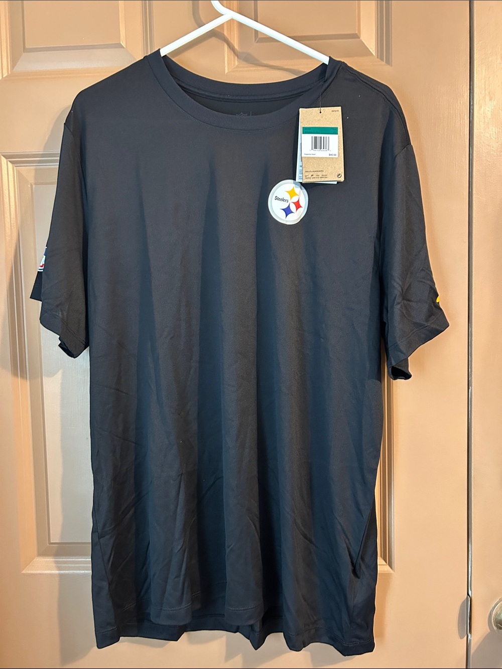 Nike Black Short-Sleeve Tee with Small Team Patch.